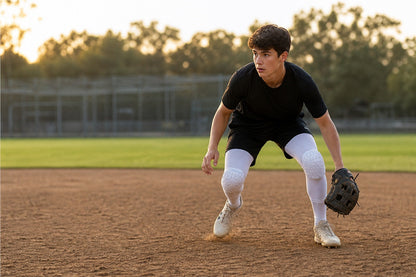 Player sprinting wearing white honeycomb pad knee sleeves
